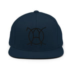 Unwritten snapback cap in navy, front view with embroidered JaOcCo symbol