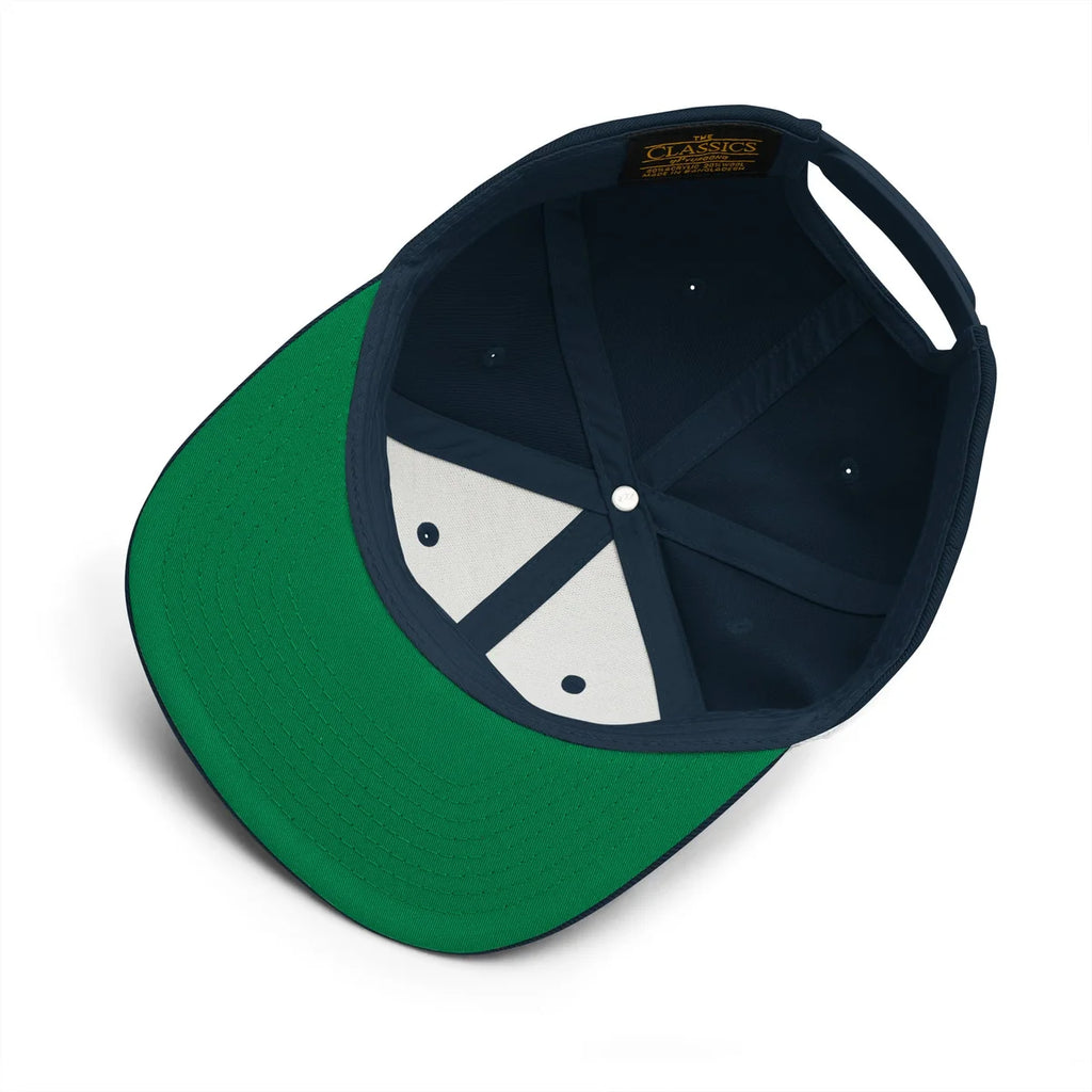 Unwritten snapback cap in navy, green under-visor and interior