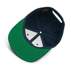 Unwritten snapback cap in navy, green under-visor and interior