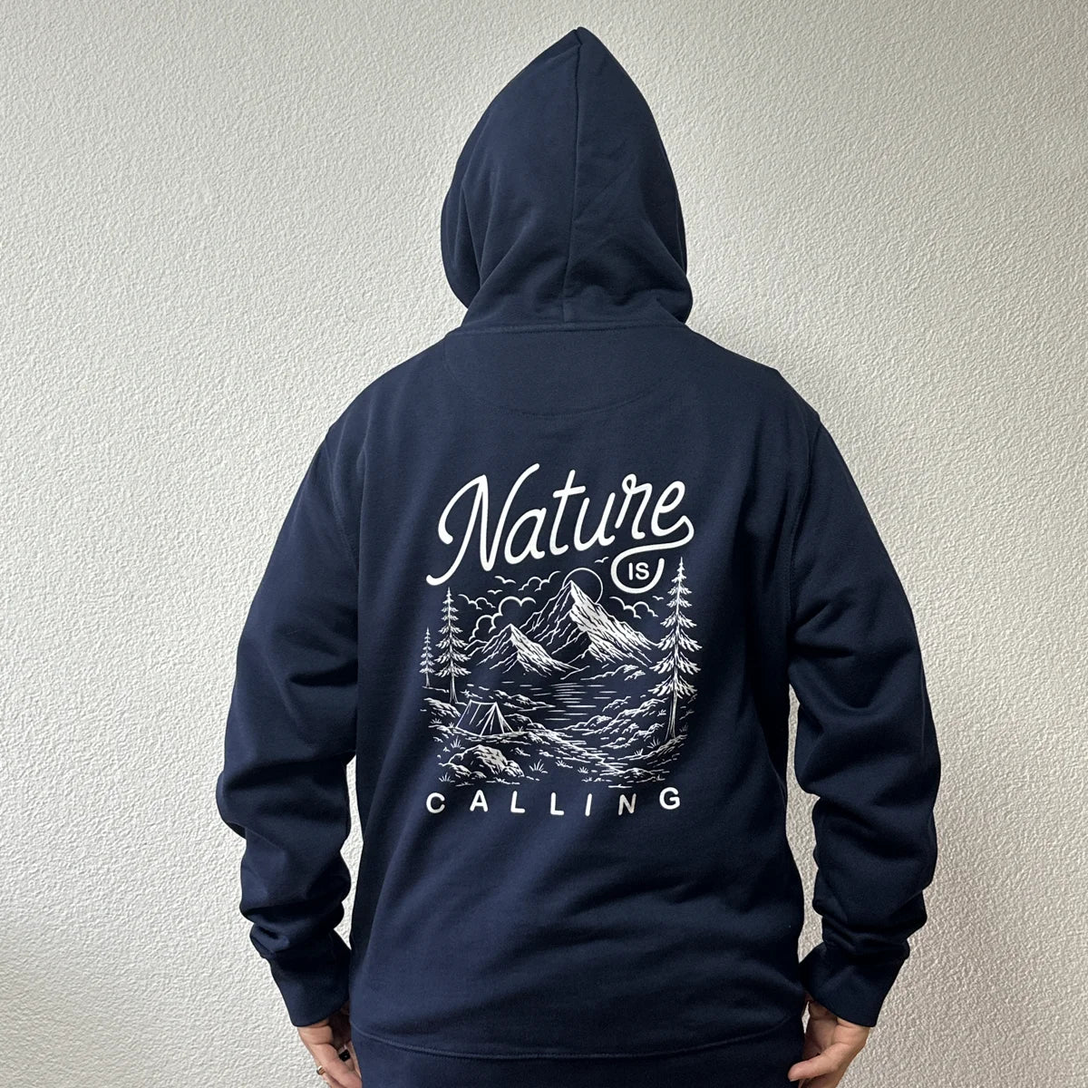 Nature Is Calling hoodie in navy worn by Benoît, founder of JaOcCo, classic fit size L, back view with the hood up