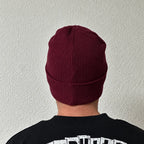Unwritten beanie in burgundy worn by Benoît, founder of JaOcCo, back view