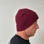 Unwritten beanie in burgundy worn by Benoît, founder of JaOcCo, three-quarter view
