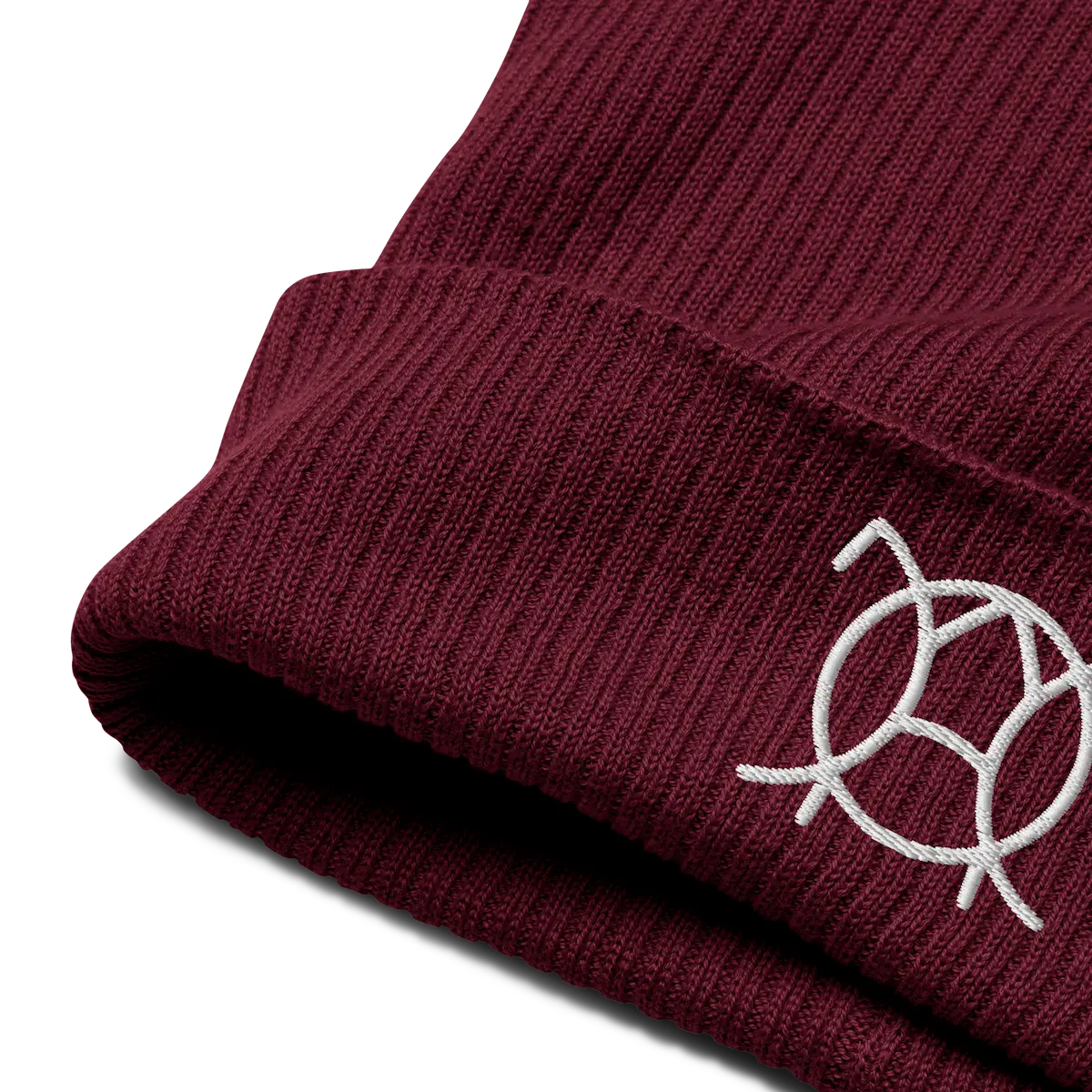 Embroidered JaOcCo logo on the cuff of the burgundy ribbed beanie