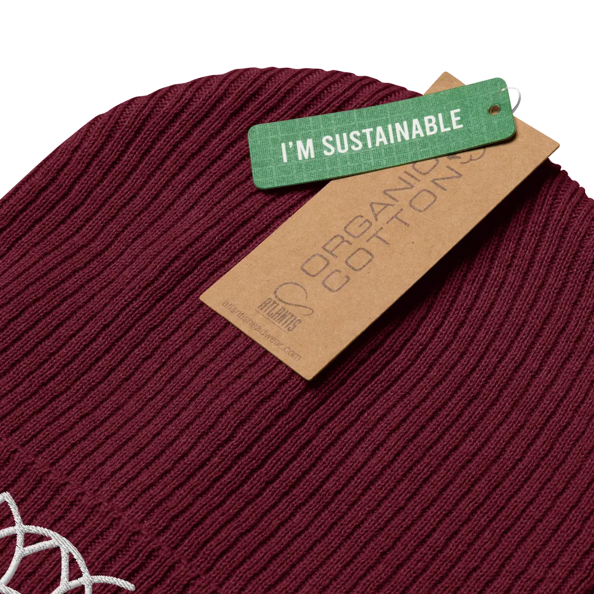 Burgundy ribbed beanie with its organic cotton tag