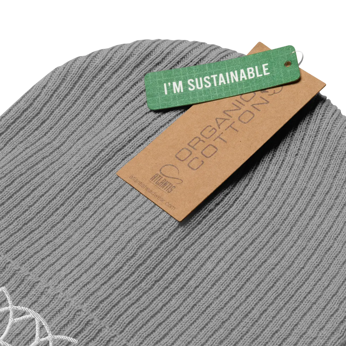 Light grey ribbed beanie with its organic cotton tag