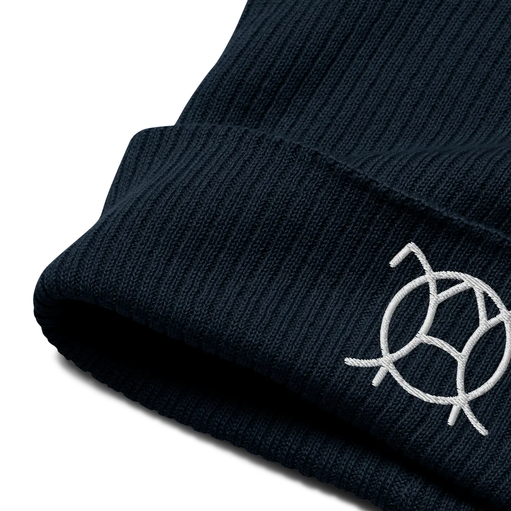 Embroidered JaOcCo logo on the cuff of the navy ribbed beanie